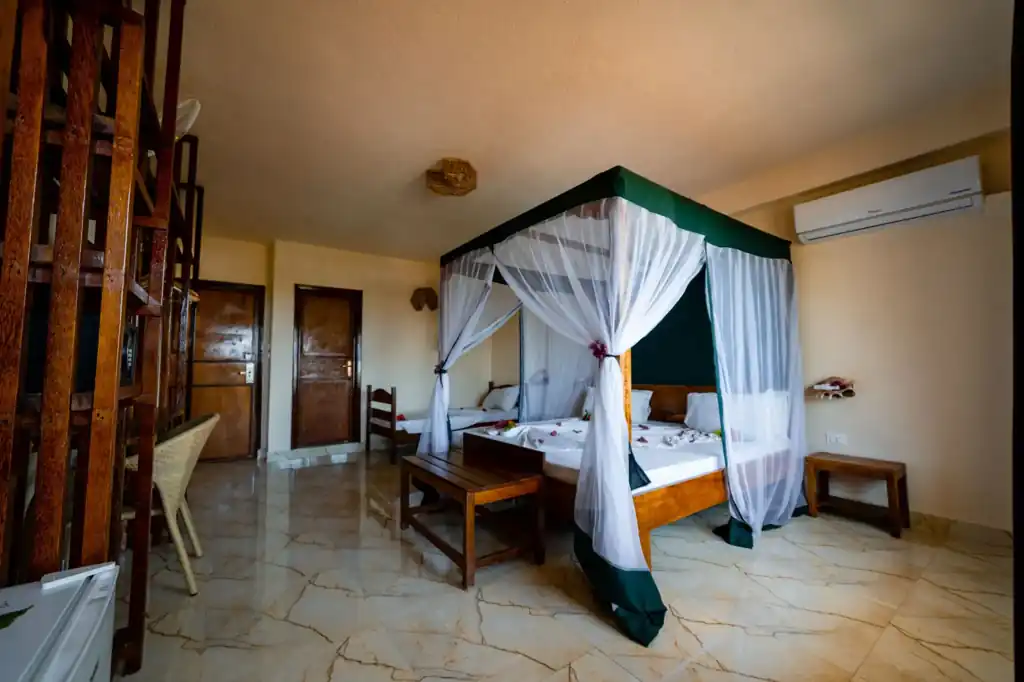 Spacious ocean-view bedroom at Palumbo the Waves Hotel in Zanzibar