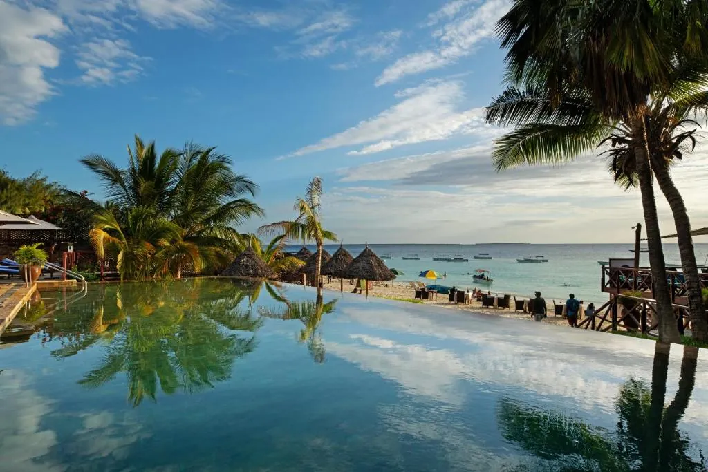 view of beach in zanzibar from an infirity pool during sunset